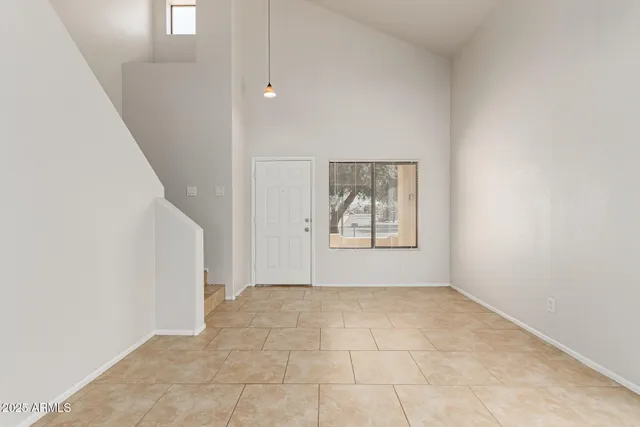 a view of an empty room with windows