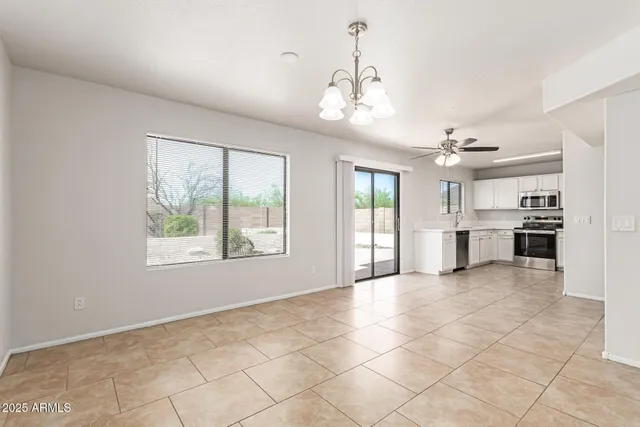 a view of a kitchen with a sink and a window