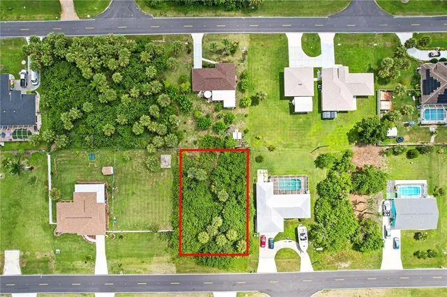 view of building with an outdoor space and seating