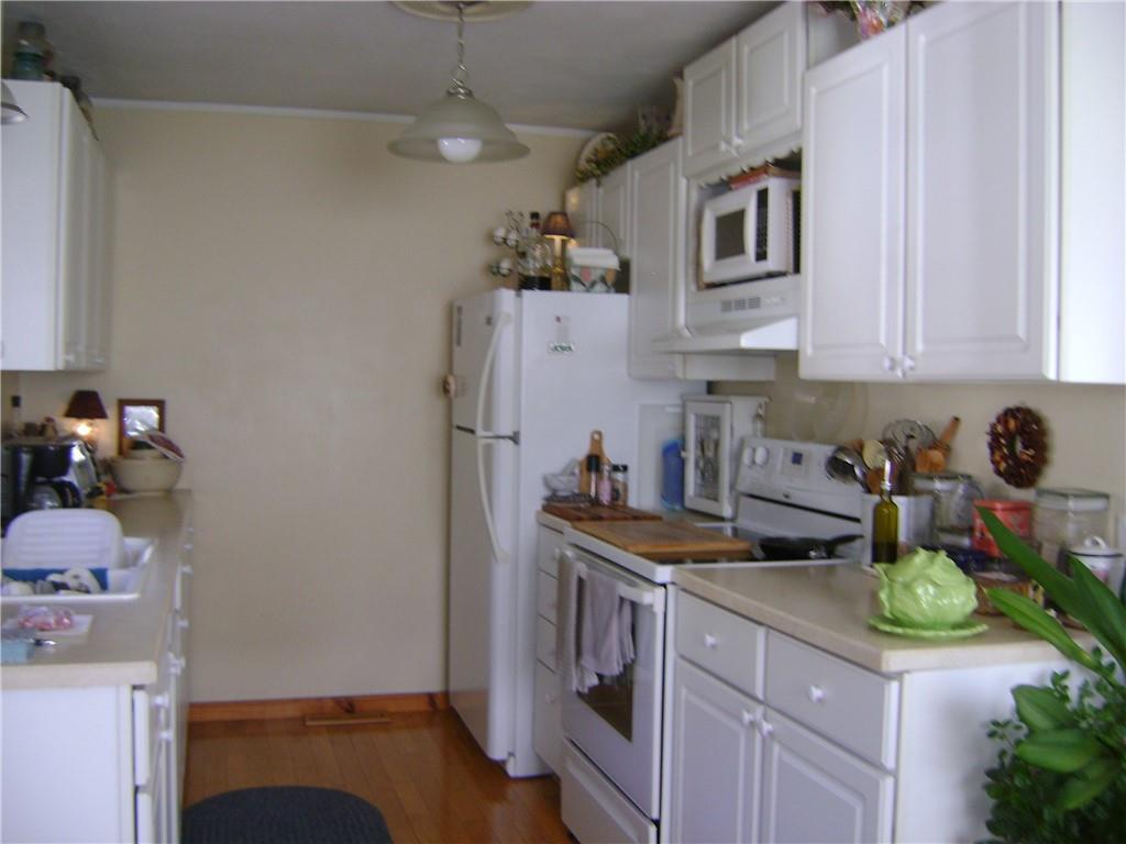 2092 McArthur Road Jamestown, PA 16134 - Photo 16 of 48 a kitchen with stainless steel appliances granite countertop a sink stove and refrigerator