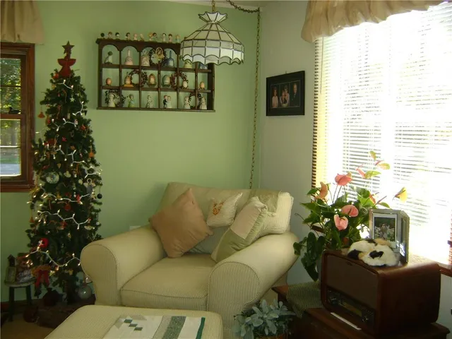 a bedroom with furniture and a window