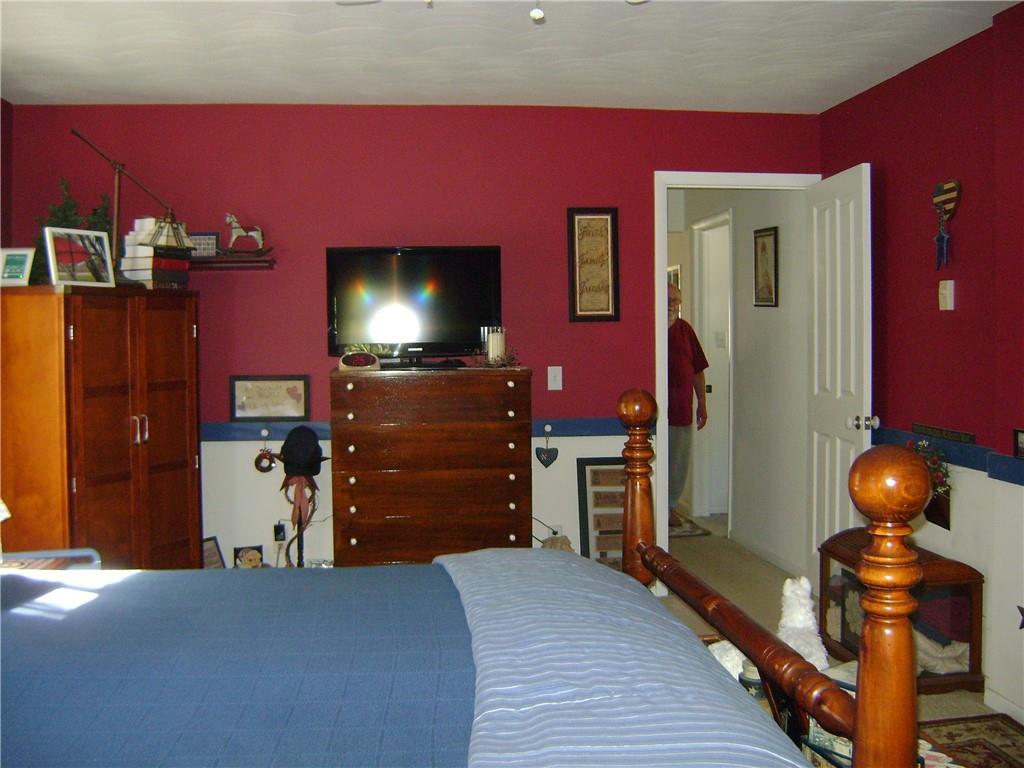 2092 McArthur Road Jamestown, PA 16134 - Photo 23 of 48 a bed room with a bed and a television