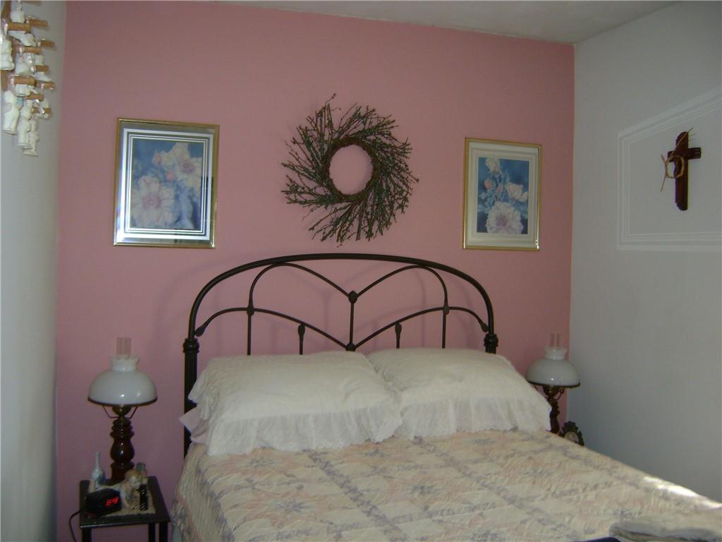 2092 McArthur Road Jamestown, PA 16134 - Photo 30 of 48 a bedroom with a bed and a chandelier