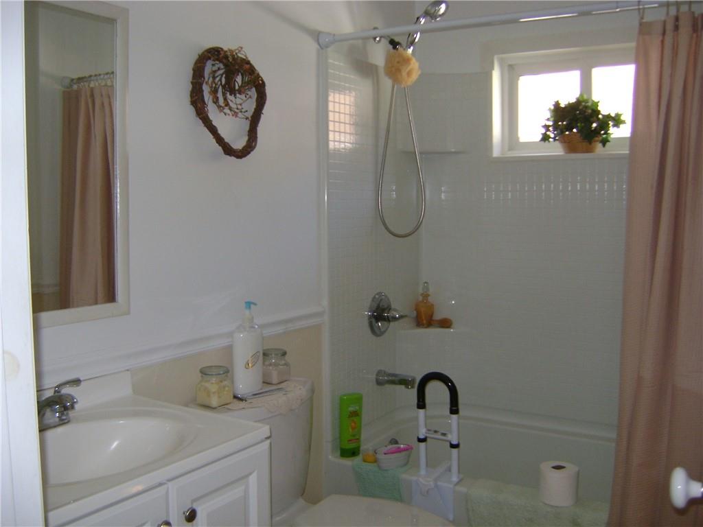 2092 McArthur Road Jamestown, PA 16134 - Photo 31 of 48 a bathroom with a granite countertop sink mirror and vanity