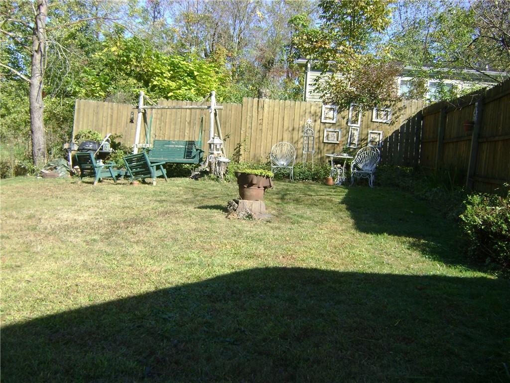 2092 McArthur Road Jamestown, PA 16134 - Photo 36 of 48 a view of a backyard with plants and a slide