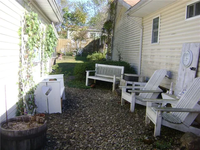a view of a patio with a chairs and table in the patio