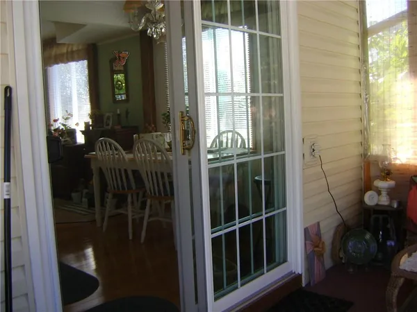 a view of a dining room with furniture and chandelier