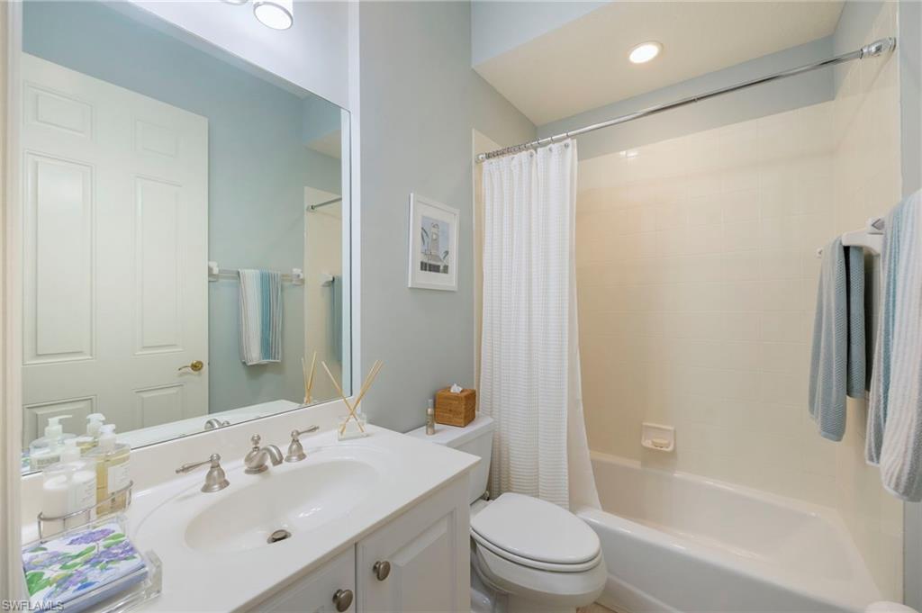 9288 Grassi Way, Unit 102 Naples, FL 34114 - Photo 19 of 37 Full bath with shower / bath combo and vanity