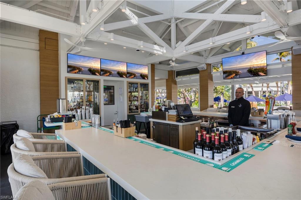 9288 Grassi Way, Unit 102 Naples, FL 34114 - Photo 32 of 37 View of patio featuring a bar