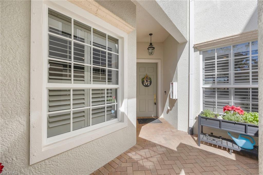 9288 Grassi Way, Unit 102 Naples, FL 34114 - Photo 3 of 37 a house with outdoor space
