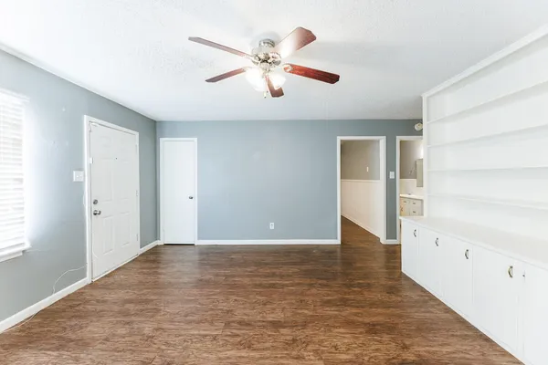 a kitchen with granite countertop a stove and a microwave