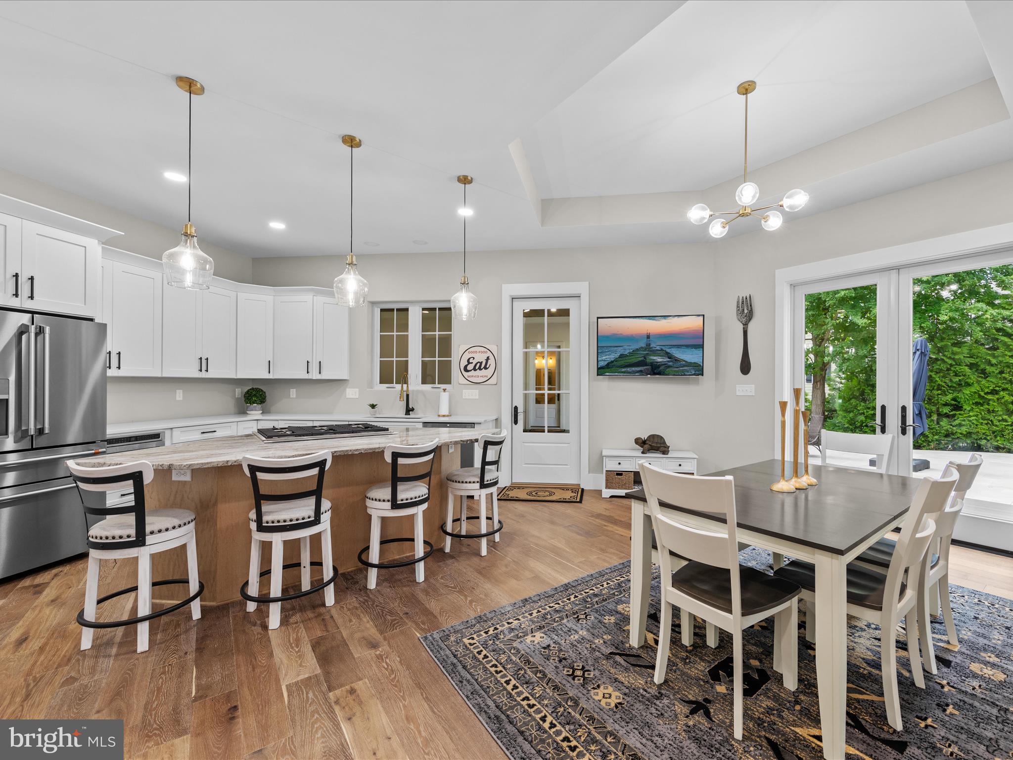 Kitchen opens to great room, pool deck