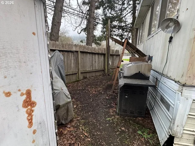 a kitchen with granite countertop a sink stove and refrigerator