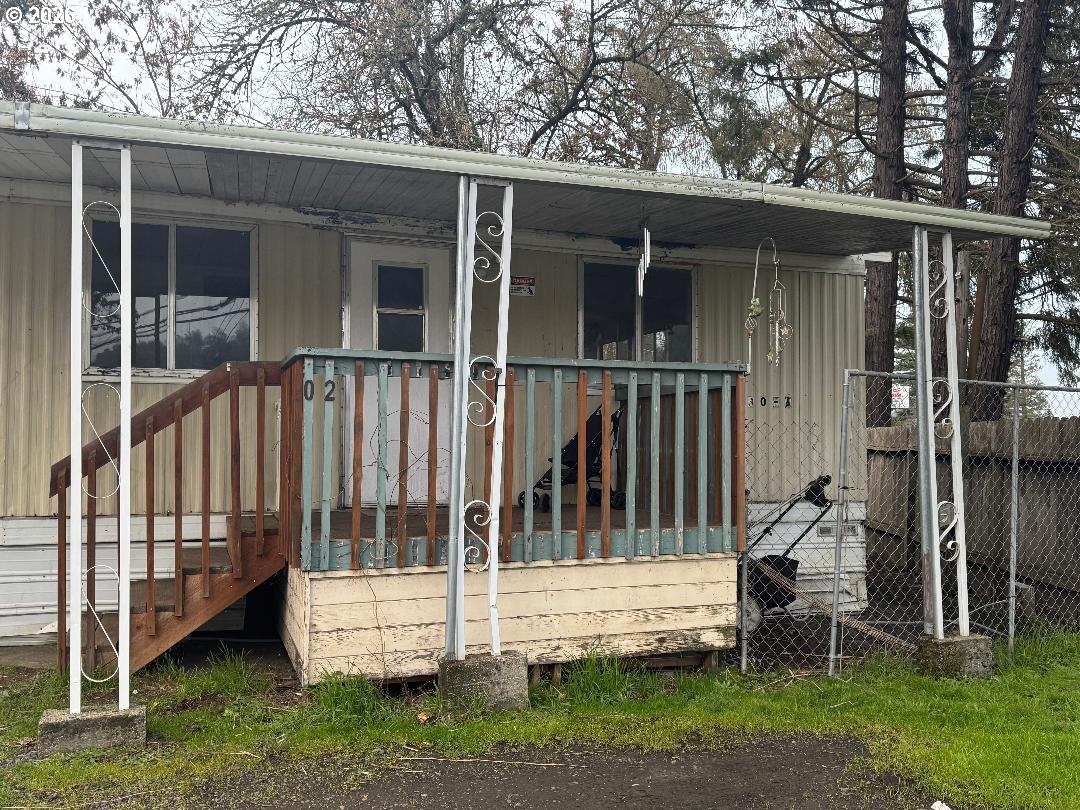 5000 Northeast Stephens Street, Unit 2 Roseburg, OR 97470 - Photo 2 of 23 a view of a house with a yard and sitting area