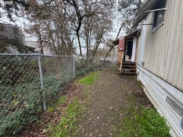 a backyard of a house with lots of green space