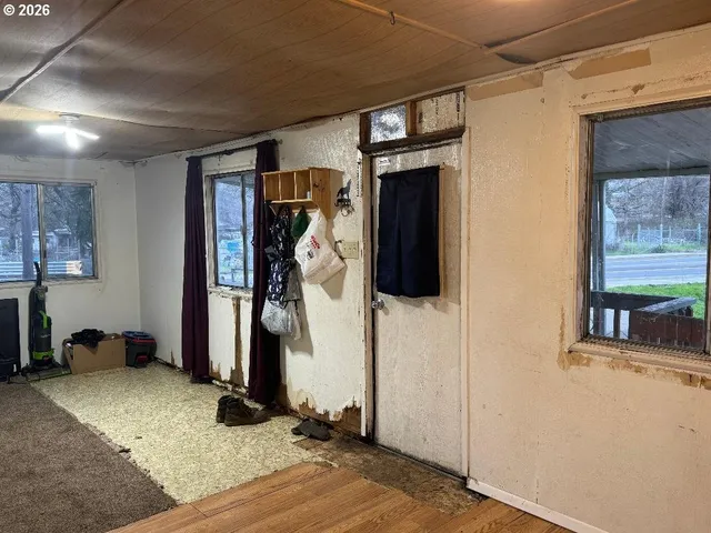 a kitchen with a refrigerator sink and wooden cabinets