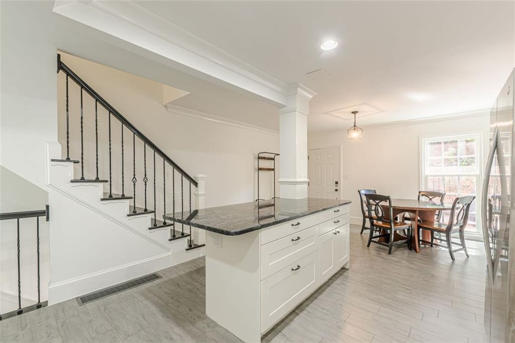 320 Alberta Terrace Northeast, Unit 3 Atlanta, GA 30305 - Photo 20 of 54 a view of a hallway with dining room and furniture