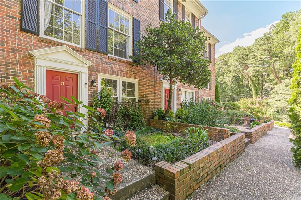 320 Alberta Terrace Northeast, Unit 3 Atlanta, GA 30305 - Photo 2 of 54 front view of a house with a yard