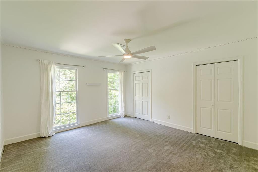 320 Alberta Terrace Northeast, Unit 3 Atlanta, GA 30305 - Photo 45 of 54 a view of a livingroom with a ceiling fan and window