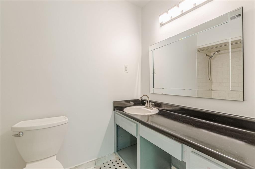 320 Alberta Terrace Northeast, Unit 3 Atlanta, GA 30305 - Photo 46 of 54 a bathroom with a sink and a toilet