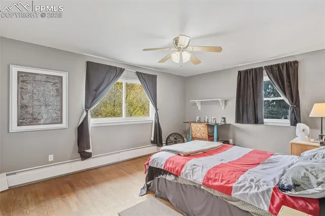 a bedroom with a large bed and a window