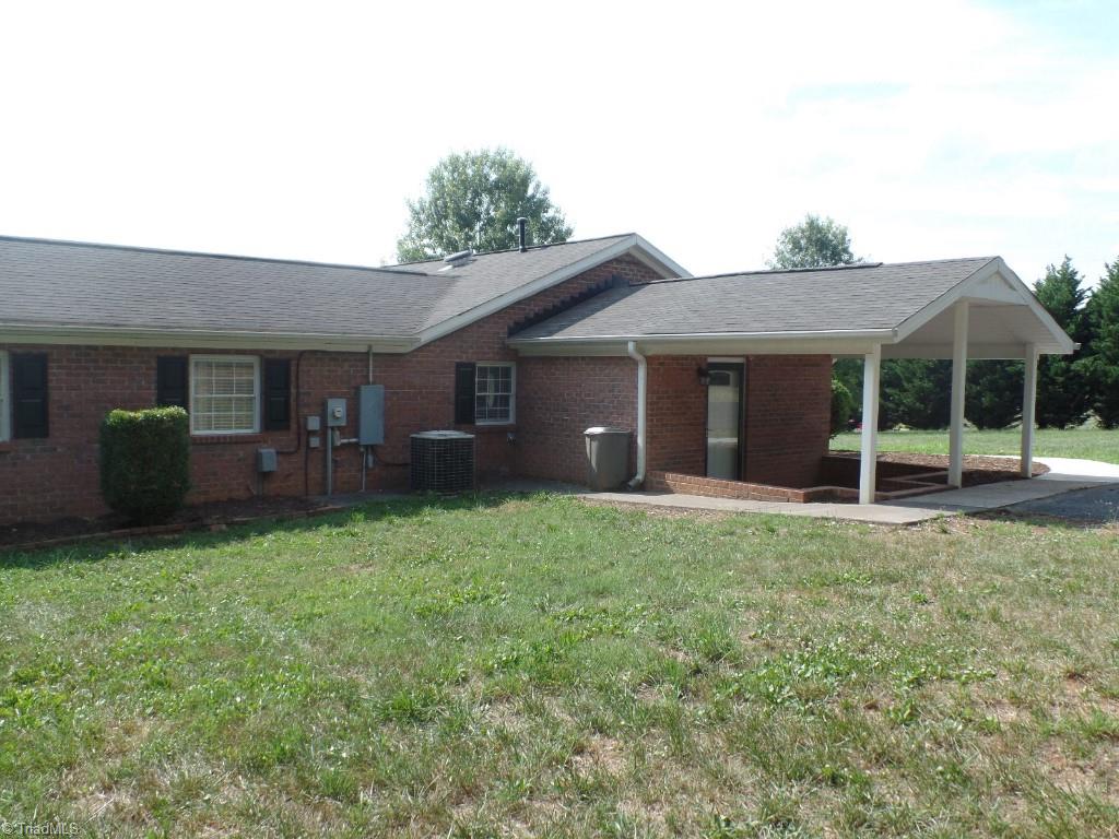 1939 Bloomtown Road East Bend, NC 27018 - Photo 20 of 26 Covered side porch with brick in laid flooring.