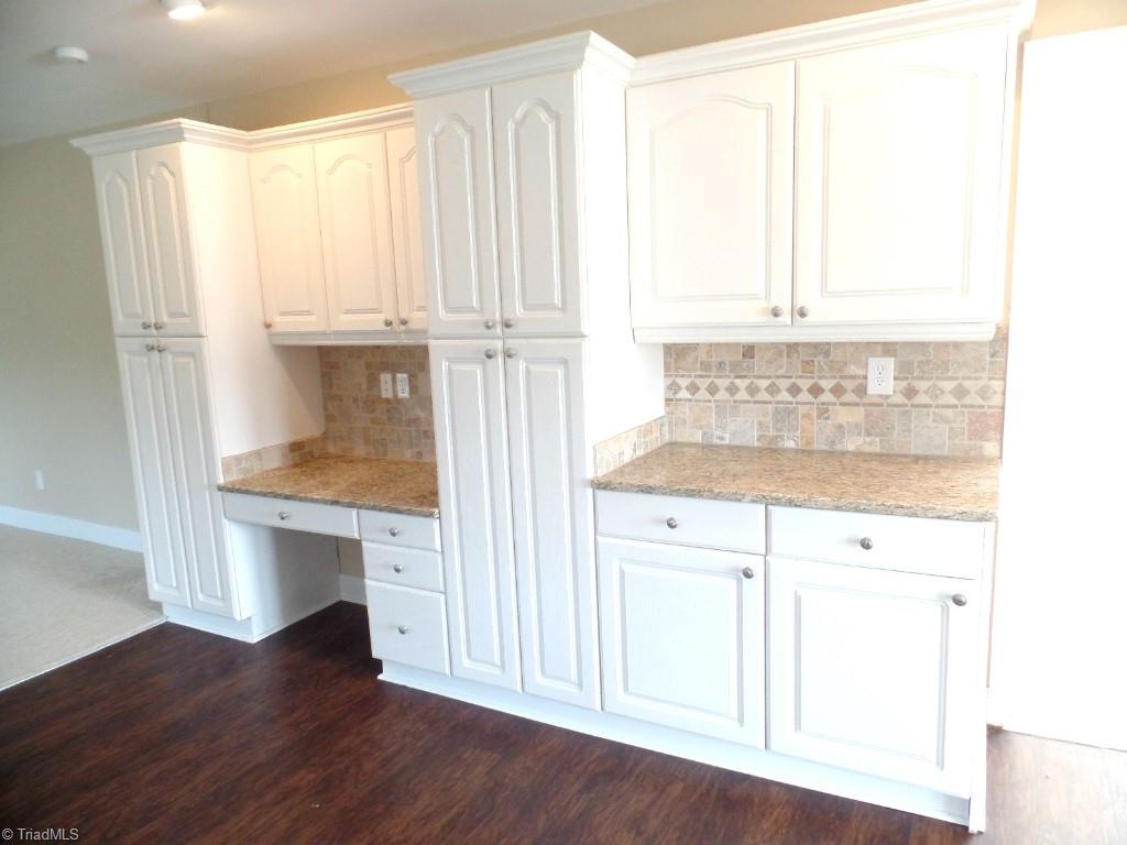 1939 Bloomtown Road East Bend, NC 27018 - Photo 4 of 26 Pantry cabinets with desk built in.