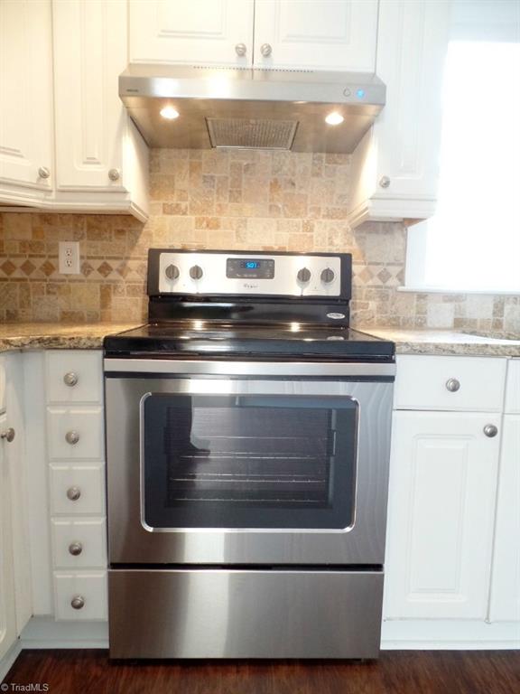 1939 Bloomtown Road East Bend, NC 27018 - Photo 6 of 26 Brand new stainless steel smooth top range with stainless vent hood.