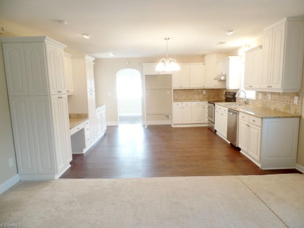 1939 Bloomtown Road East Bend, NC 27018 - Photo 8 of 26 Spacious kitchen with luxury vinyl plank flooring.