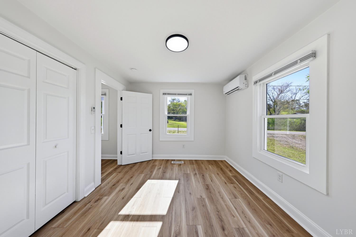 1410 Lynch Road Altavista, VA 24517 - Photo 12 of 34 a view of a room with wooden floor and windows