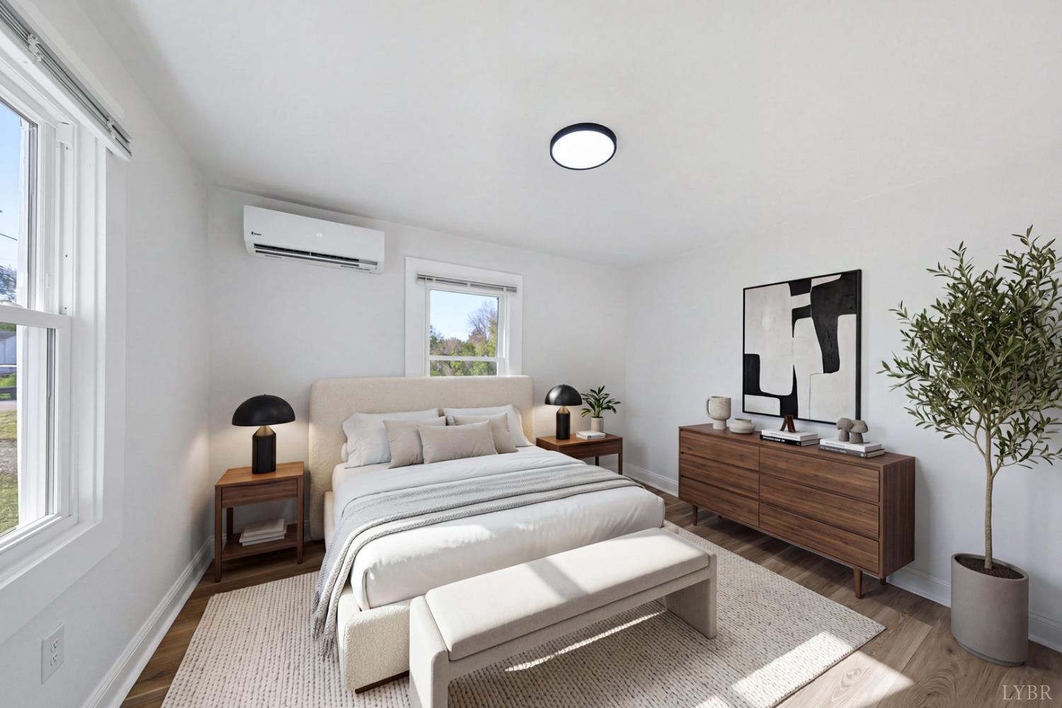 1410 Lynch Road Altavista, VA 24517 - Photo 14 of 34 a bedroom with two beds and potted plants next to a window