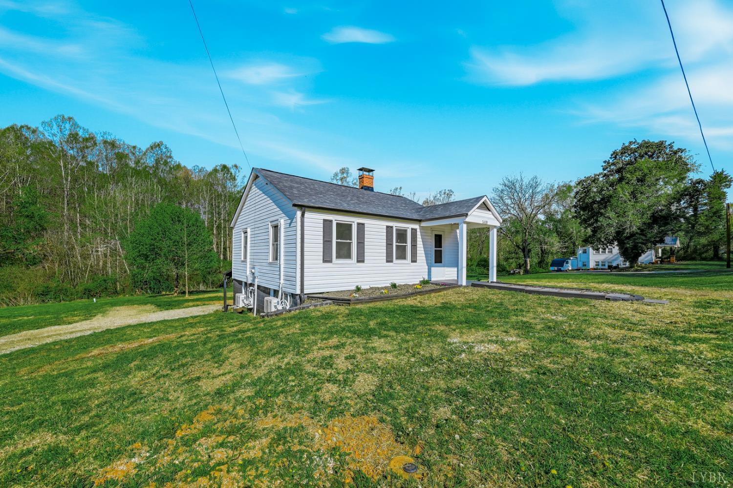 1410 Lynch Road Altavista, VA 24517 - Photo 2 of 34 a front view of a house with a yard