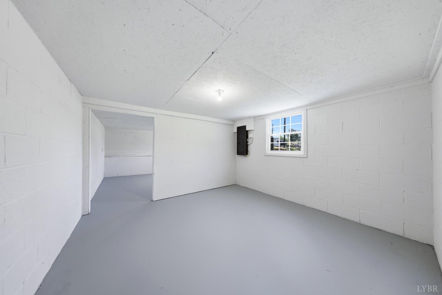 1410 Lynch Road Altavista, VA 24517 - Photo 24 of 34 an empty room with a empty space and windows