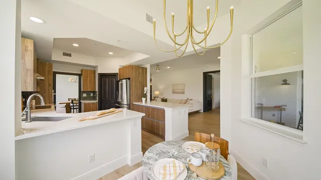 a view of walk in closet with view of living room
