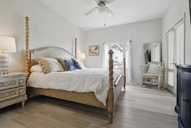 a bedroom with a bed couch and a window