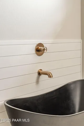 a bathroom with a bathtub and shower