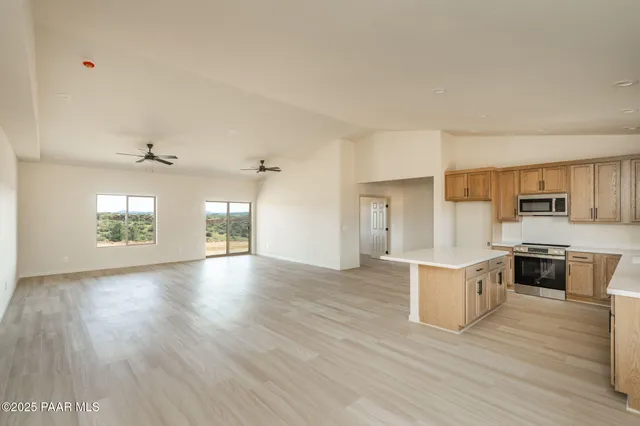 a view of kitchen with sink and wooden floor