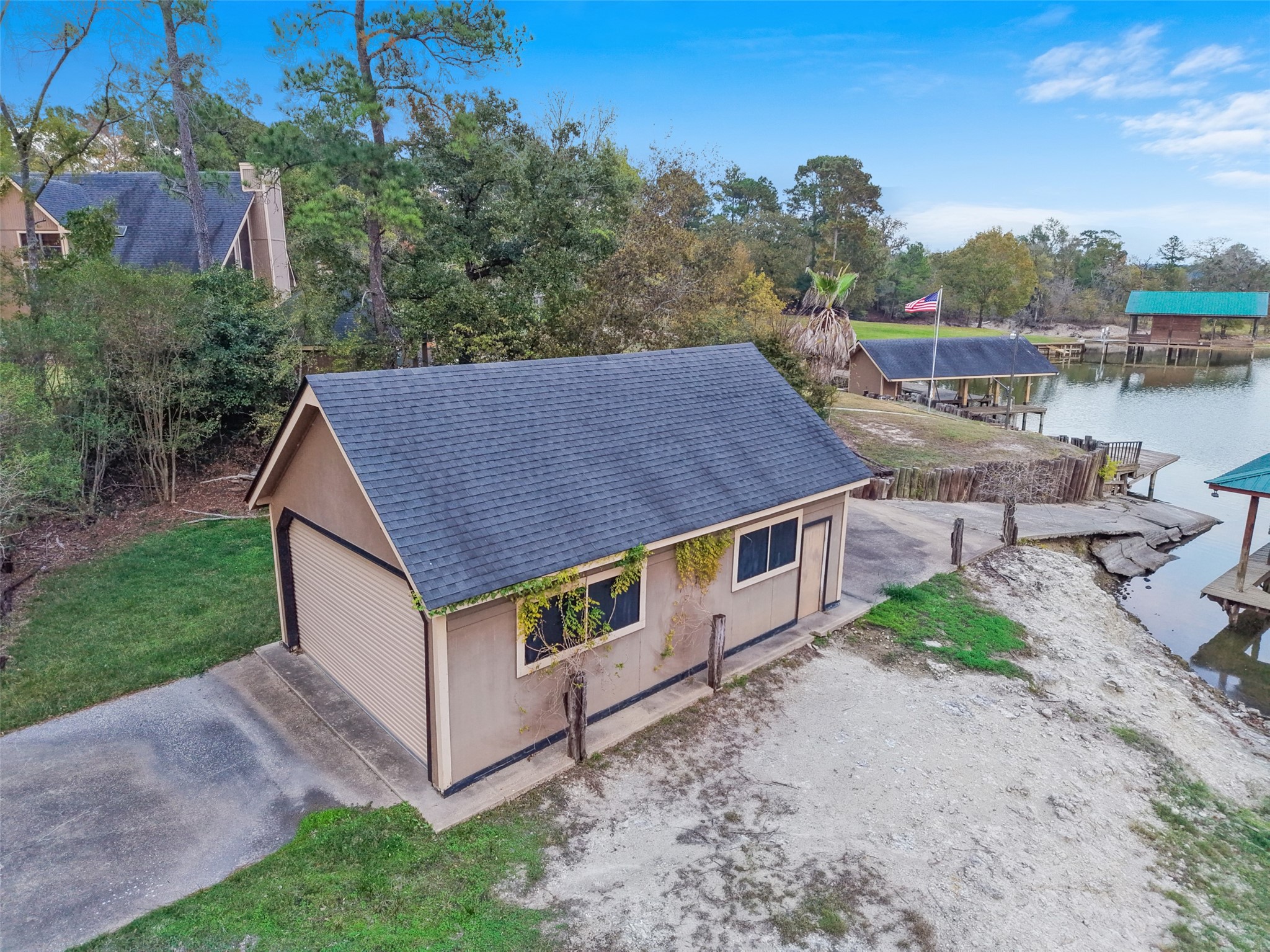 186 Lake Road Huntsville, TX 77320 - Photo 47 of 48 a aerial view of a house with a yard