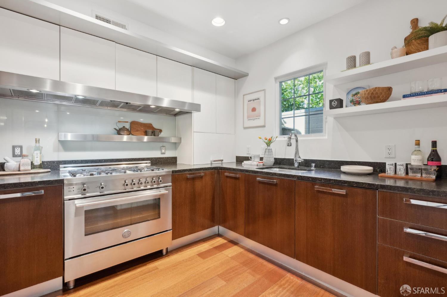 3620 19th Street, Unit 7 San Francisco, CA 94110 - Photo 12 of 39 a kitchen with sink cabinets and window