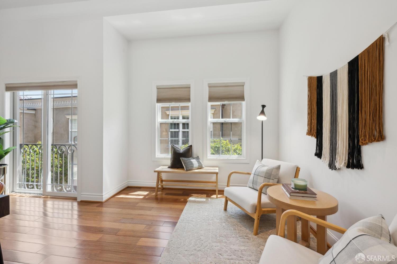 3620 19th Street, Unit 7 San Francisco, CA 94110 - Photo 23 of 39 a living room with furniture and a large window
