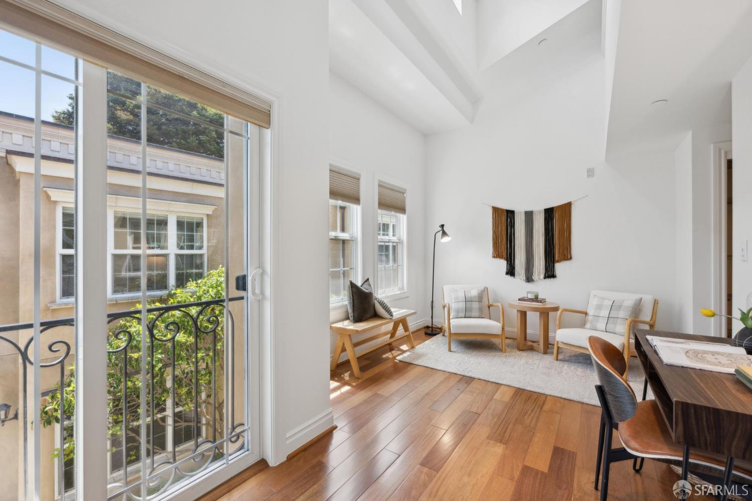 3620 19th Street, Unit 7 San Francisco, CA 94110 - Photo 29 of 39 a living room with furniture and a window