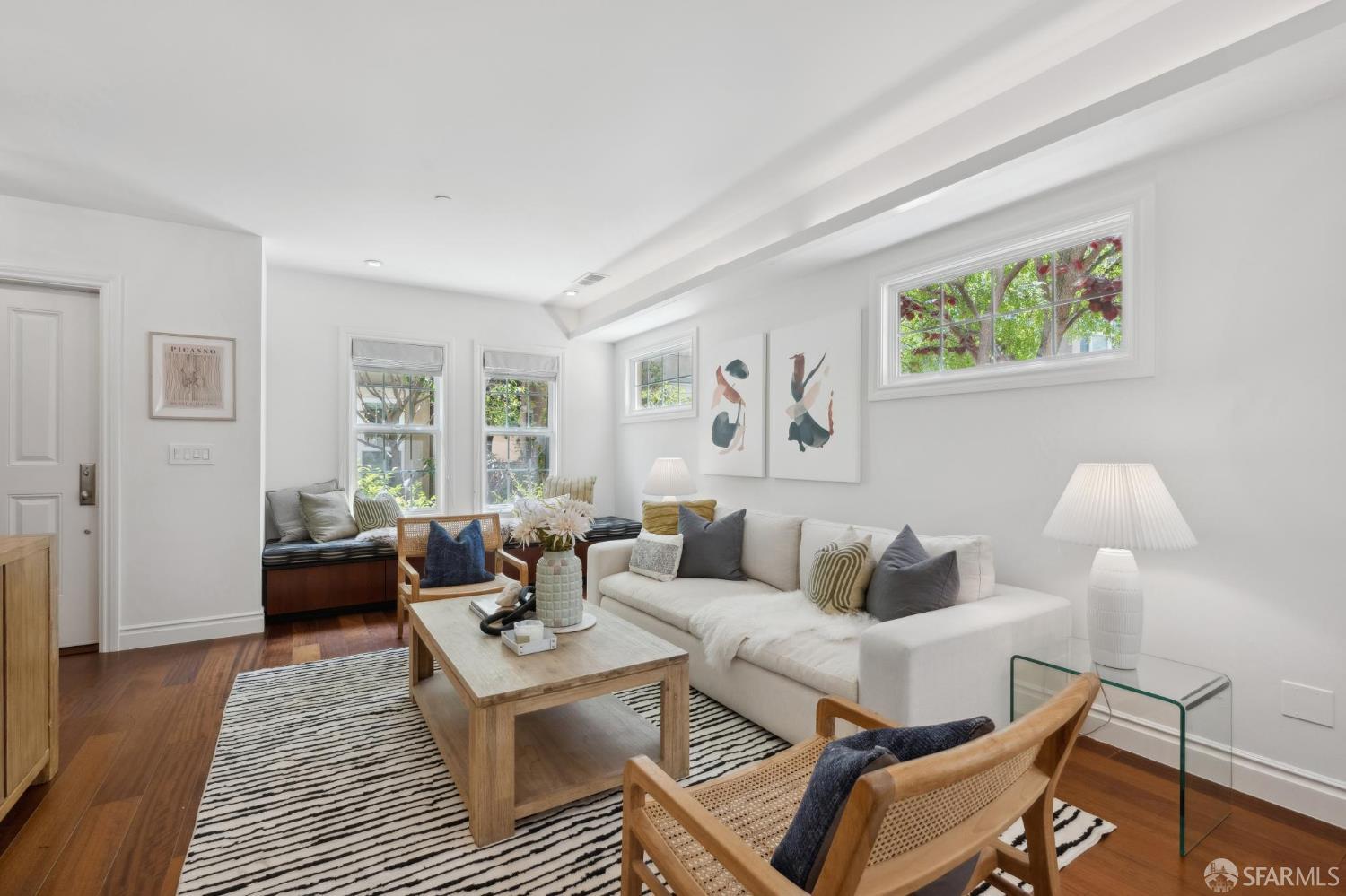 3620 19th Street, Unit 7 San Francisco, CA 94110 - Photo 3 of 39 a living room with furniture and wooden floor