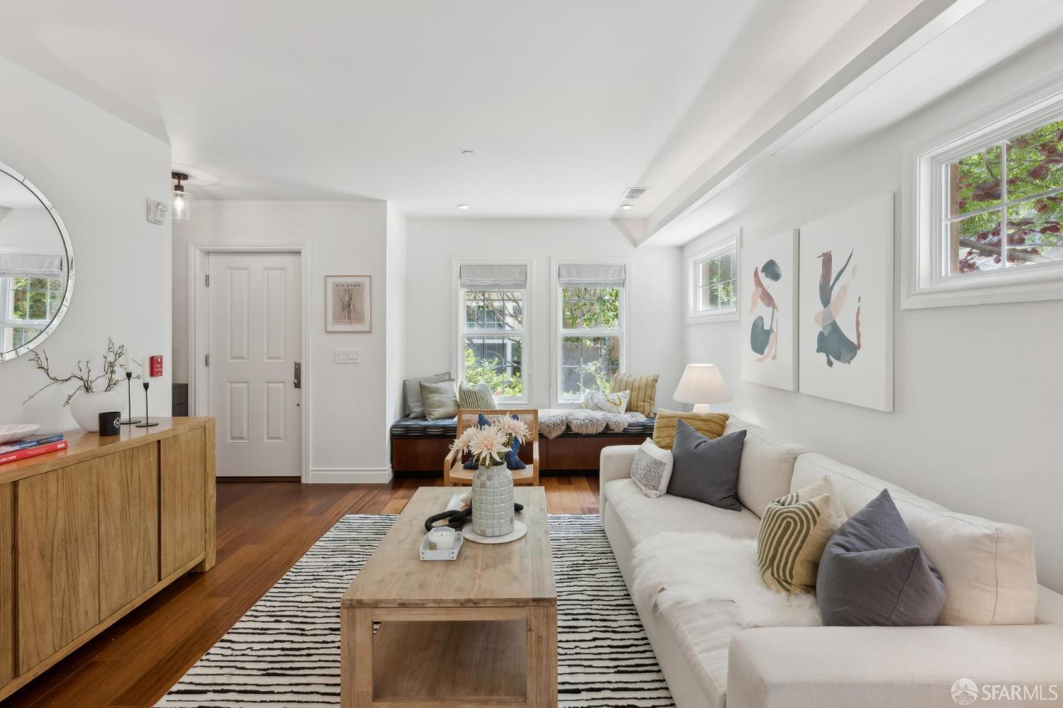 3620 19th Street, Unit 7 San Francisco, CA 94110 - Photo 4 of 39 a living room with furniture and a window