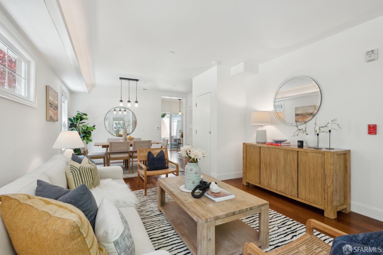 3620 19th Street, Unit 7 San Francisco, CA 94110 - Photo 5 of 39 a living room with furniture and a wooden floor