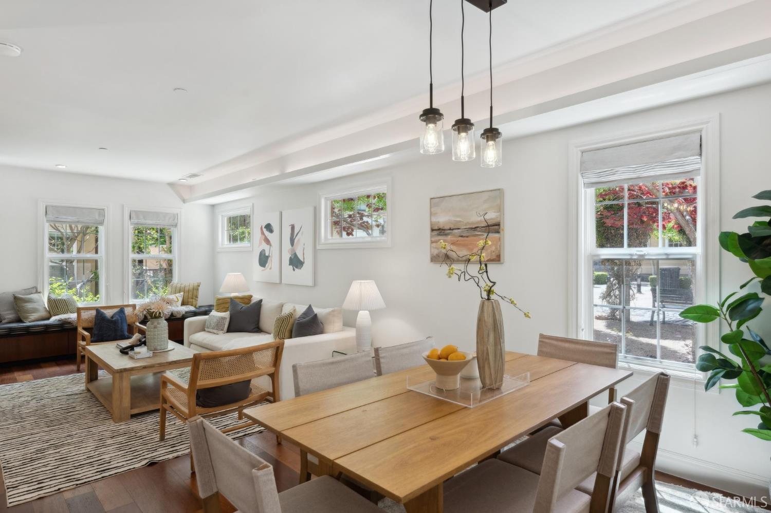 3620 19th Street, Unit 7 San Francisco, CA 94110 - Photo 7 of 39 a living room with furniture a chandelier and a table