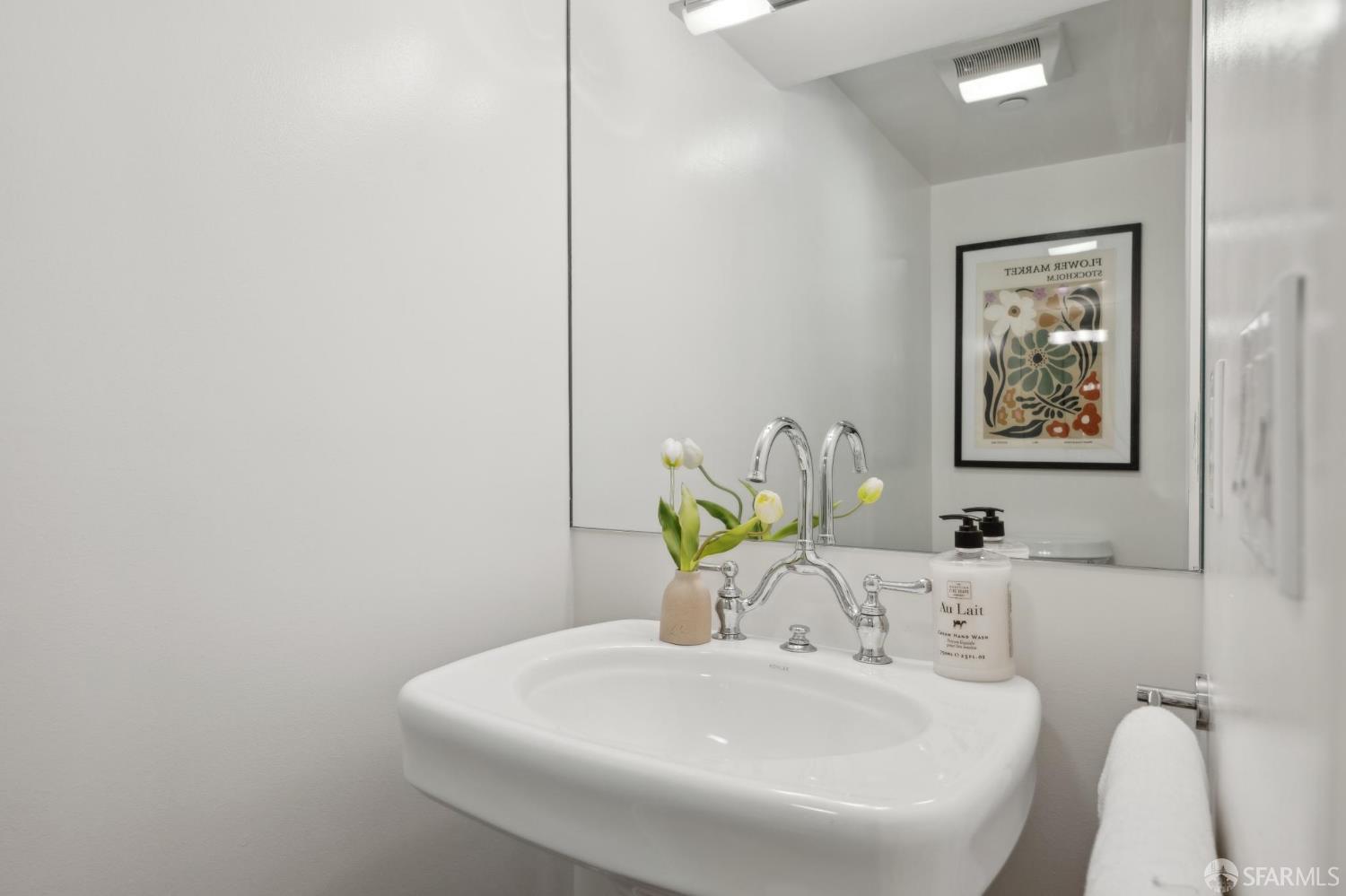 3620 19th Street, Unit 7 San Francisco, CA 94110 - Photo 8 of 39 a bathroom with a sink and a mirror