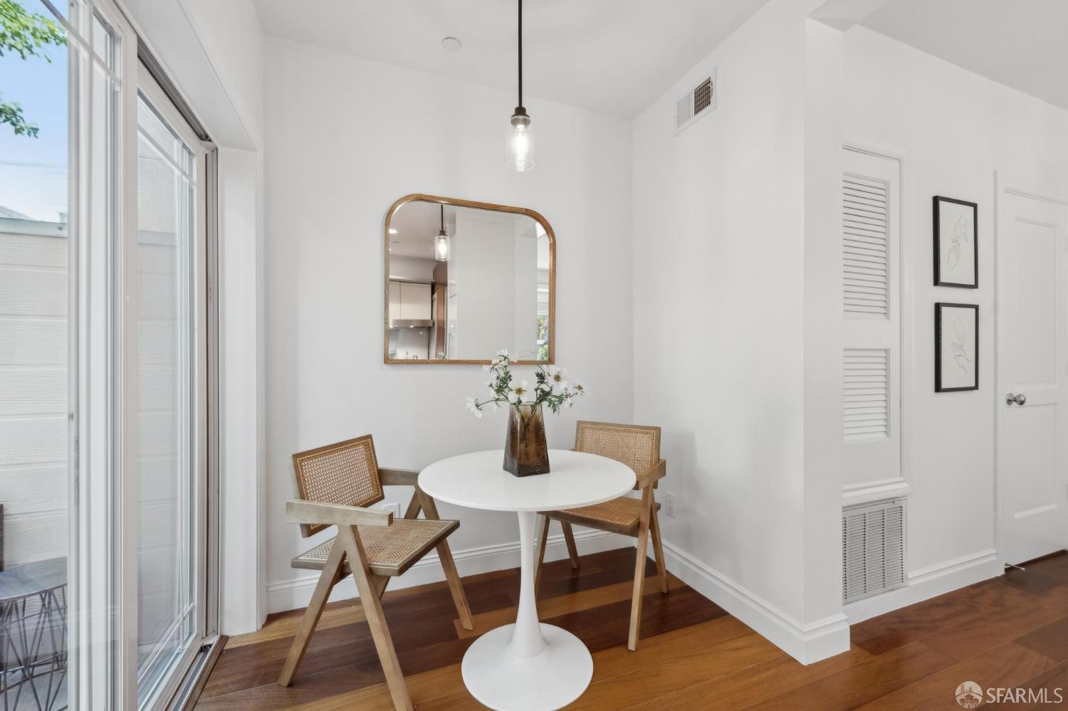 3620 19th Street, Unit 7 San Francisco, CA 94110 - Photo 10 of 39 a dining room with furniture and wooden floor