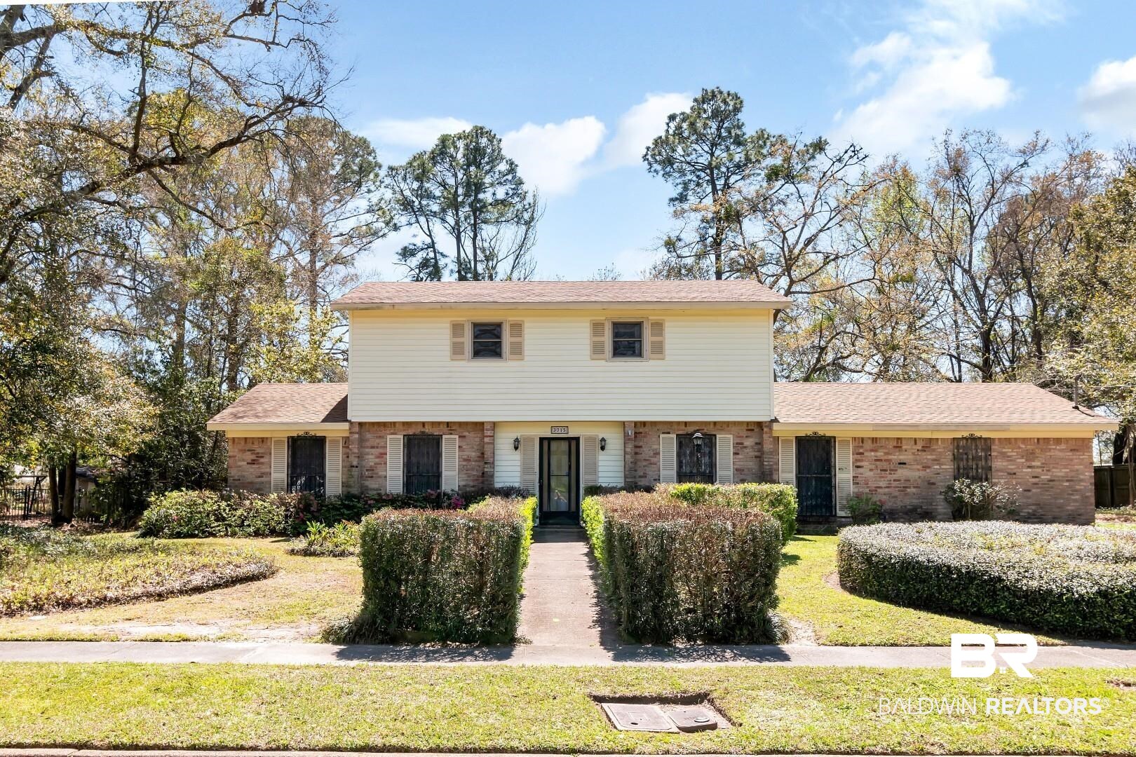 3715 South Conway Drive Mobile, AL 36608 - Photo 1 of 24 Colonial inspired home featuring a front yard and brick siding