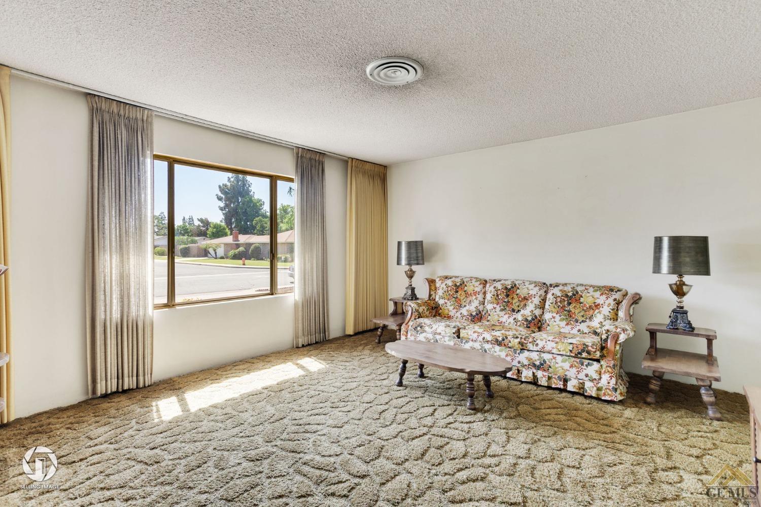 Undisclosed Address Bakersfield, CA 93308 - Photo 11 of 45 a bedroom with a bed and a window