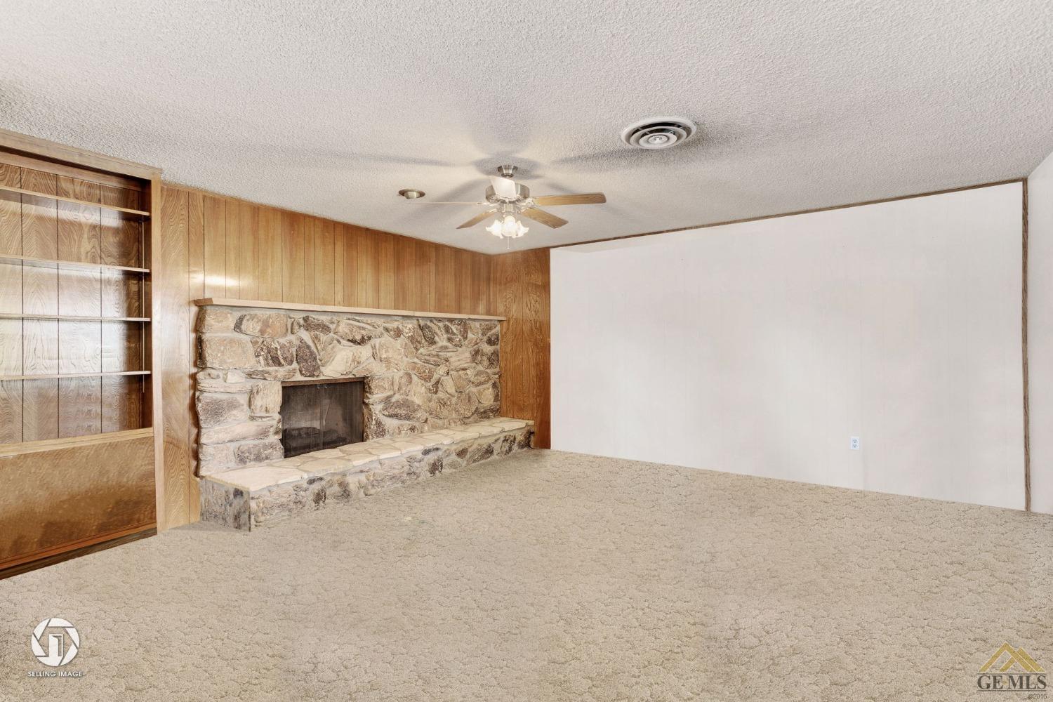 Undisclosed Address Bakersfield, CA 93308 - Photo 18 of 45 a view of a livingroom with a fireplace